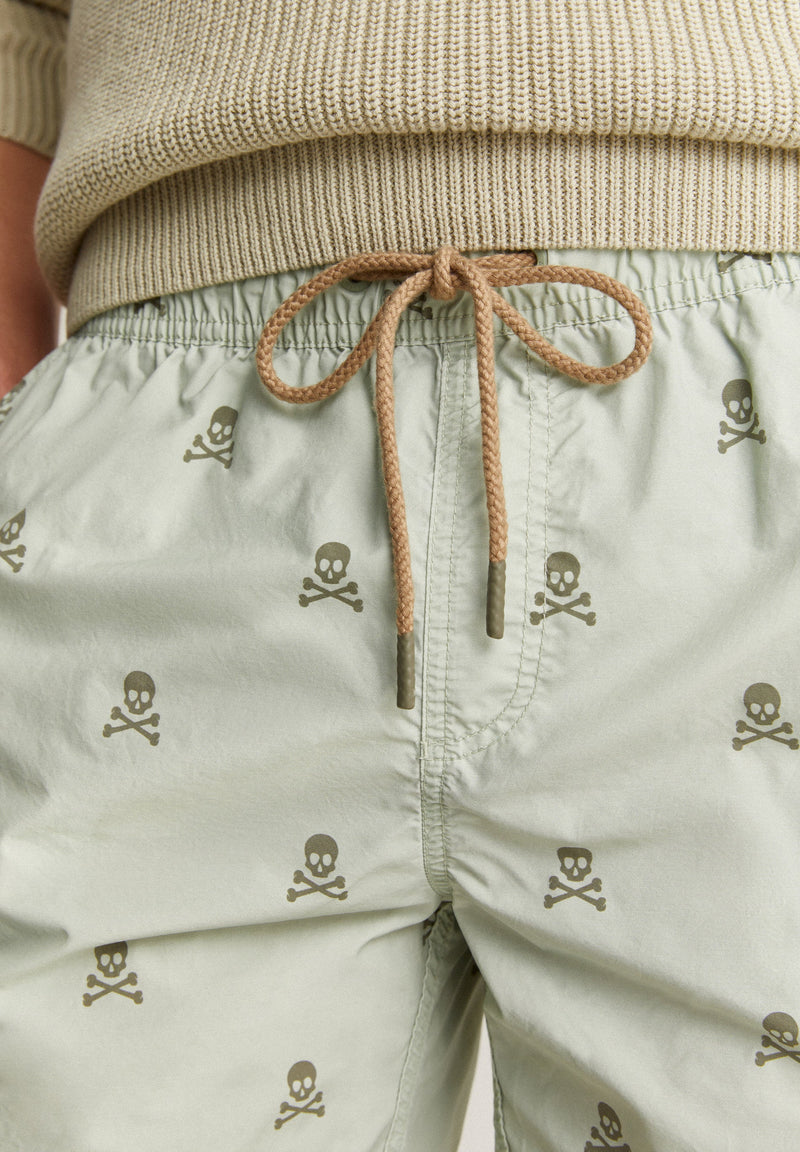SWIMMING TRUNKS WITH ALL-OVER SKULLS