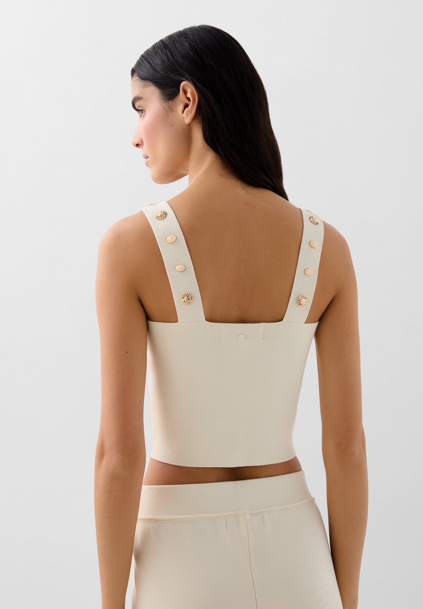 KNIT TOP WITH SUN DETAILS