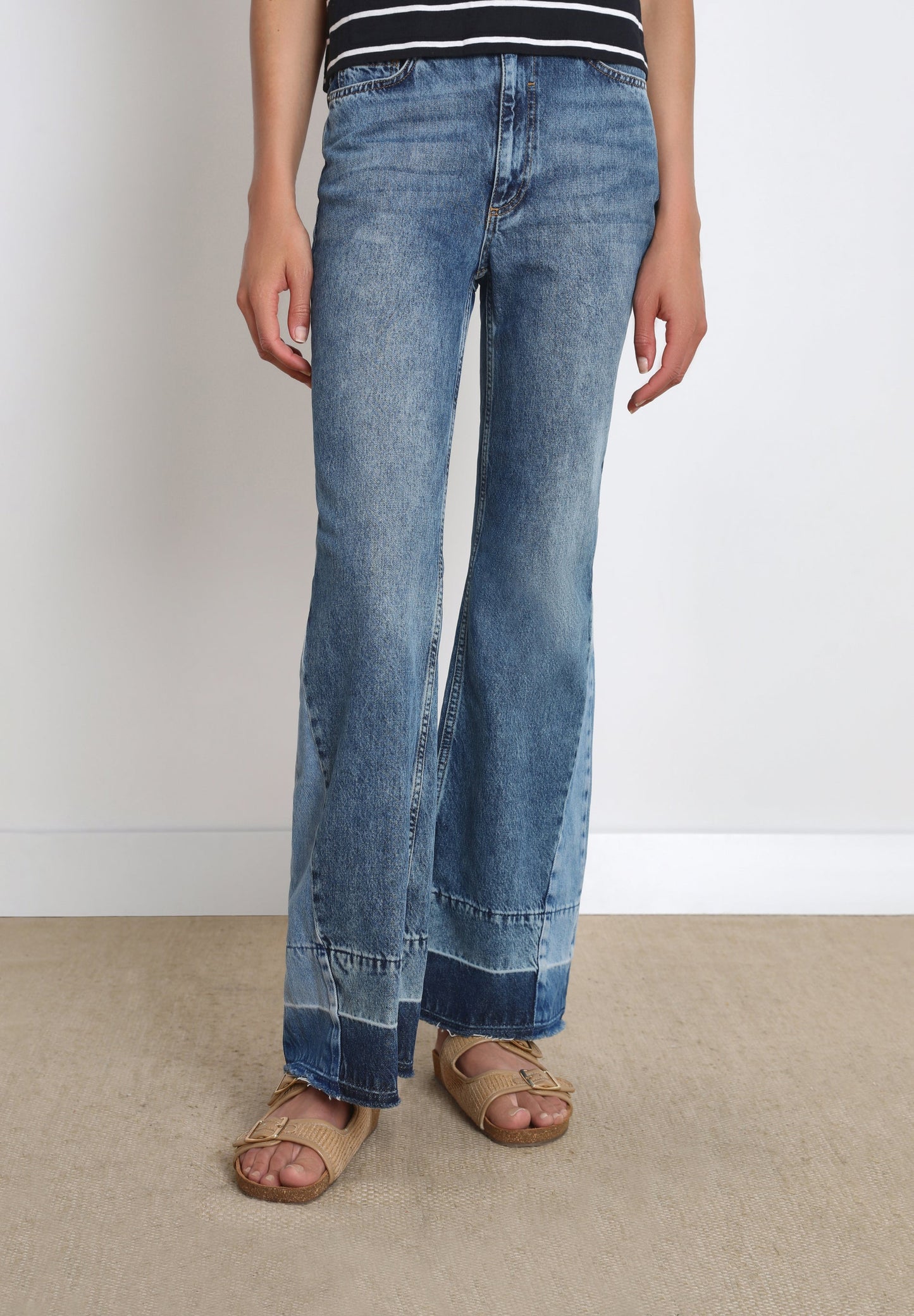 FLARED JEANS WITH PATCH ON THE HEM