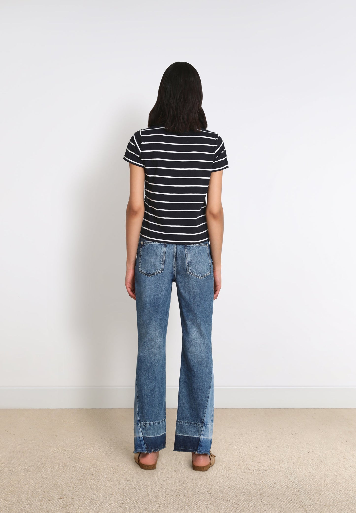 FLARED JEANS WITH PATCH ON THE HEM