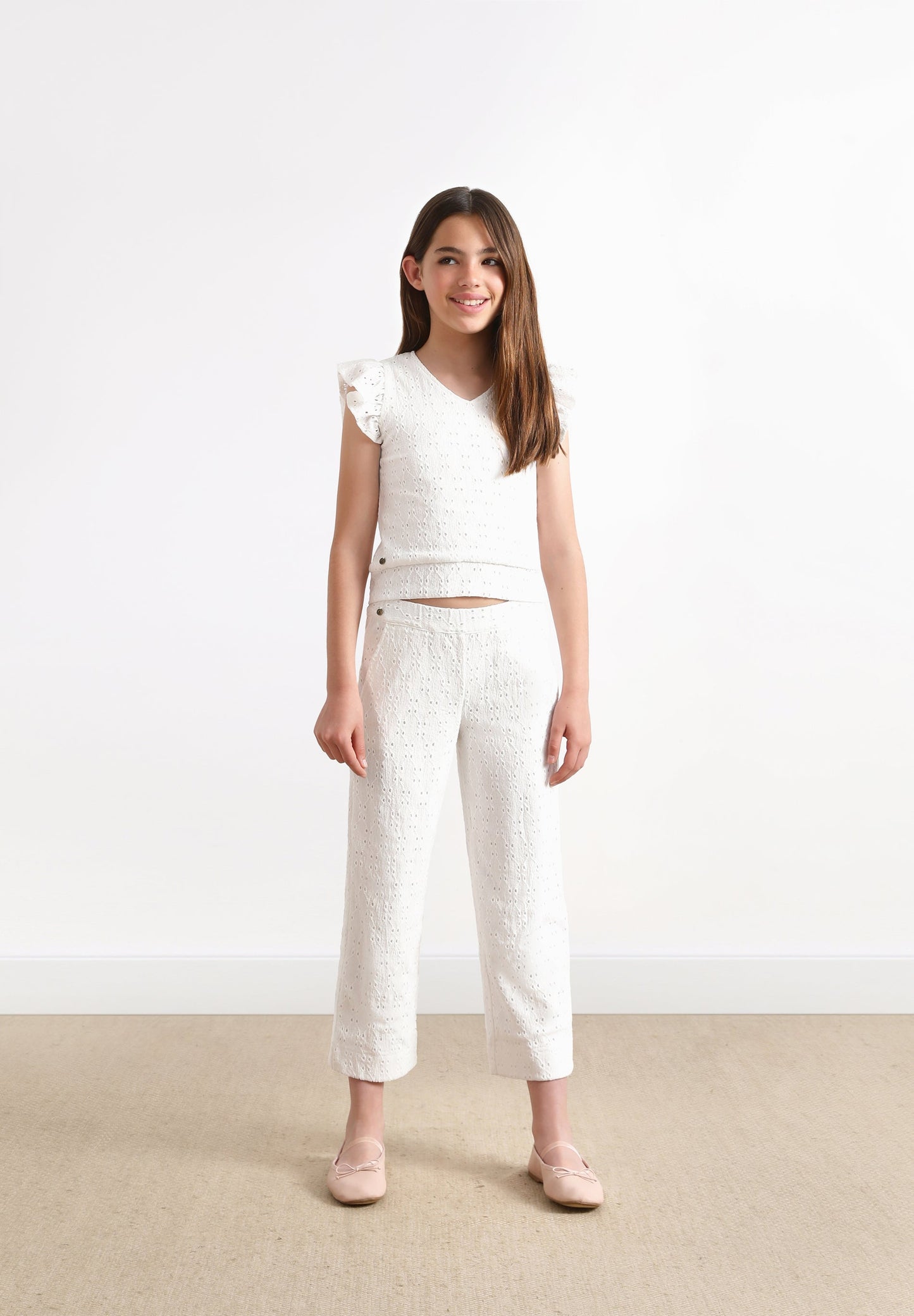 TROUSERS WITH OPENWORK DETAILS