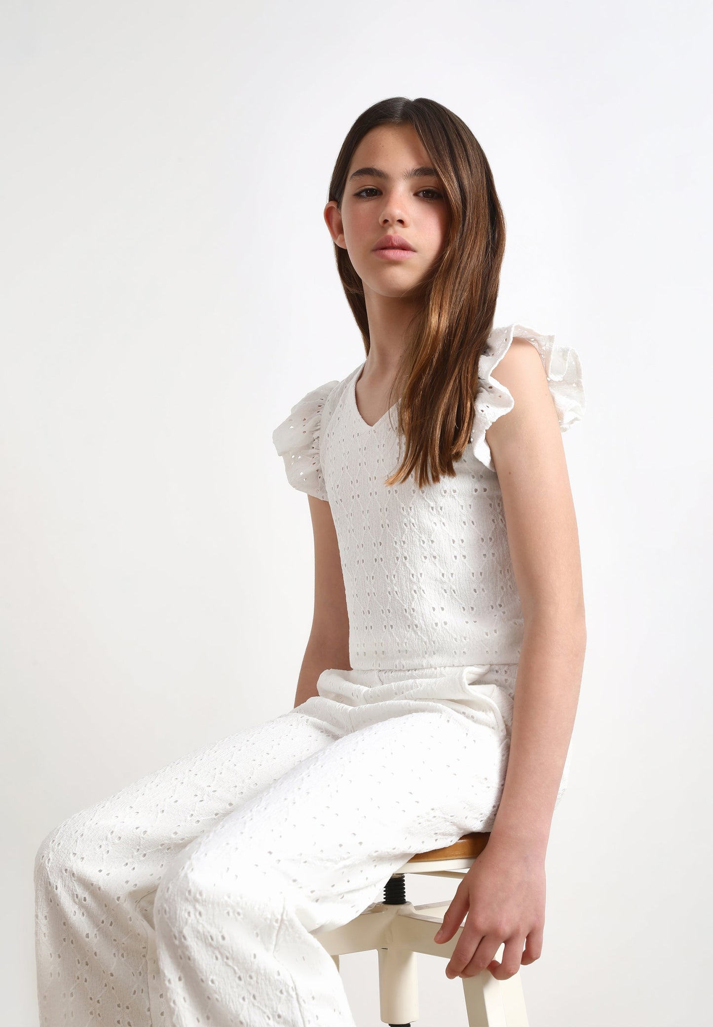 RUFFLED TOP WITH OPENWORK DETAILS