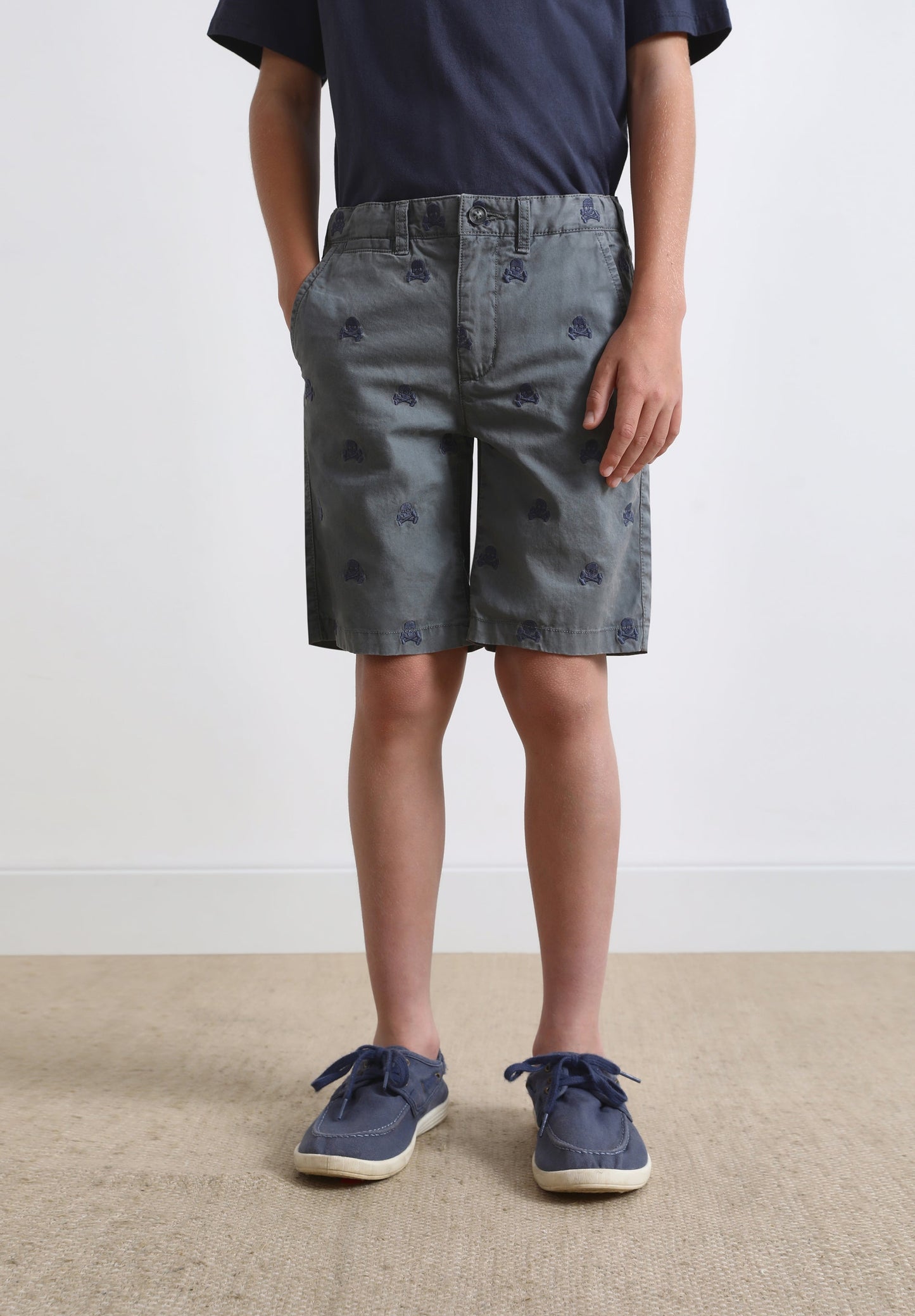 BERMUDA SHORTS WITH ALL-OVER SKULL PRINT
