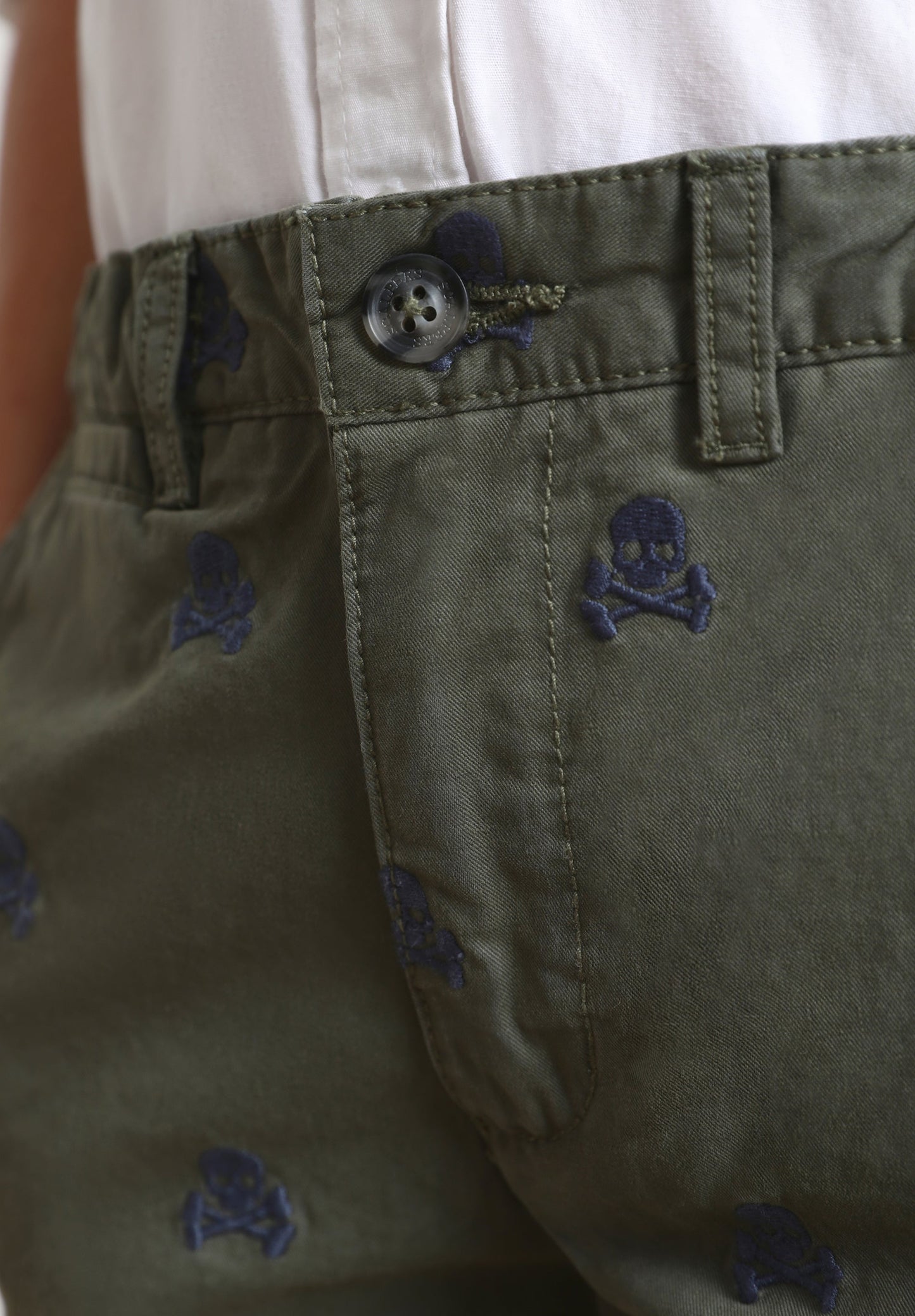 BERMUDA SHORTS WITH ALL-OVER SKULL PRINT