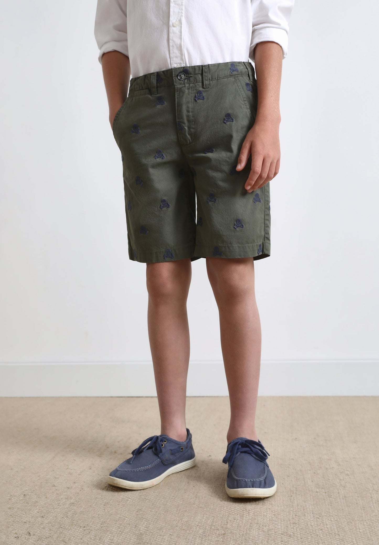 BERMUDA SHORTS WITH ALL-OVER SKULL PRINT
