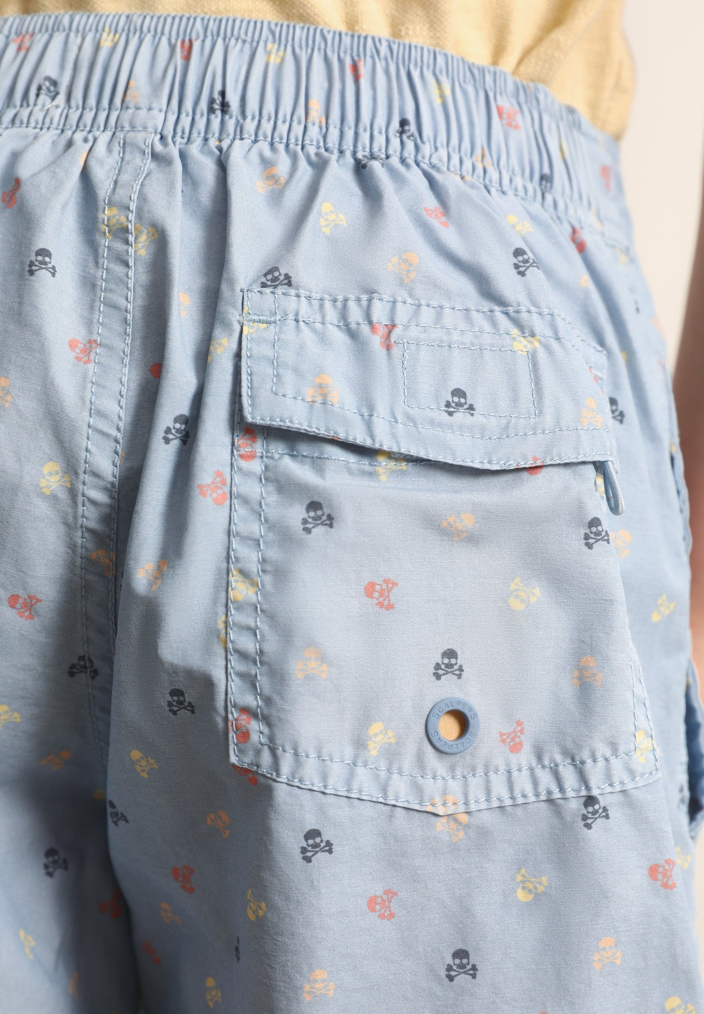 SWIMMING TRUNKS WITH ALL-OVER SKULLS
