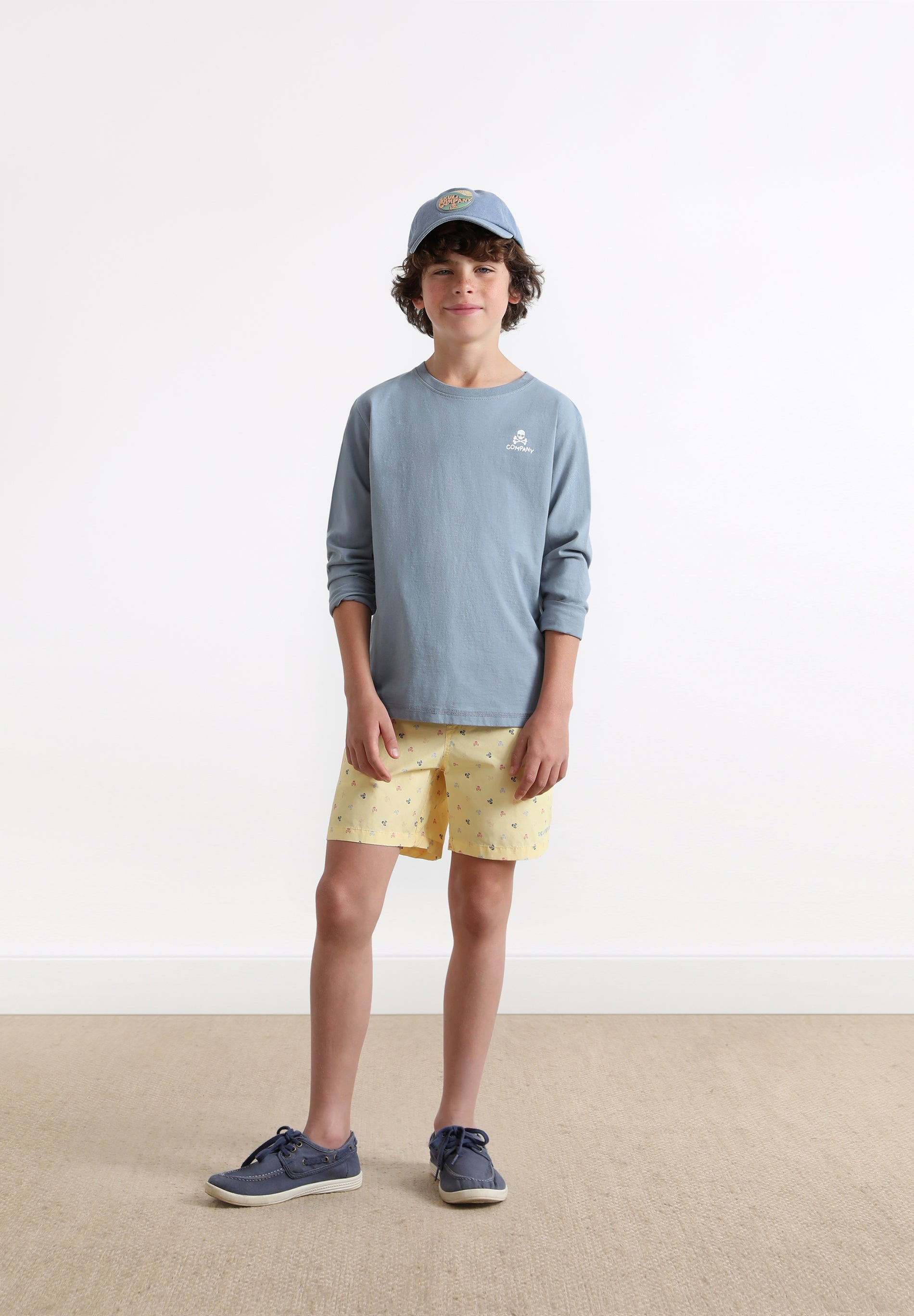 SWIMMING TRUNKS WITH ALL-OVER SKULLS