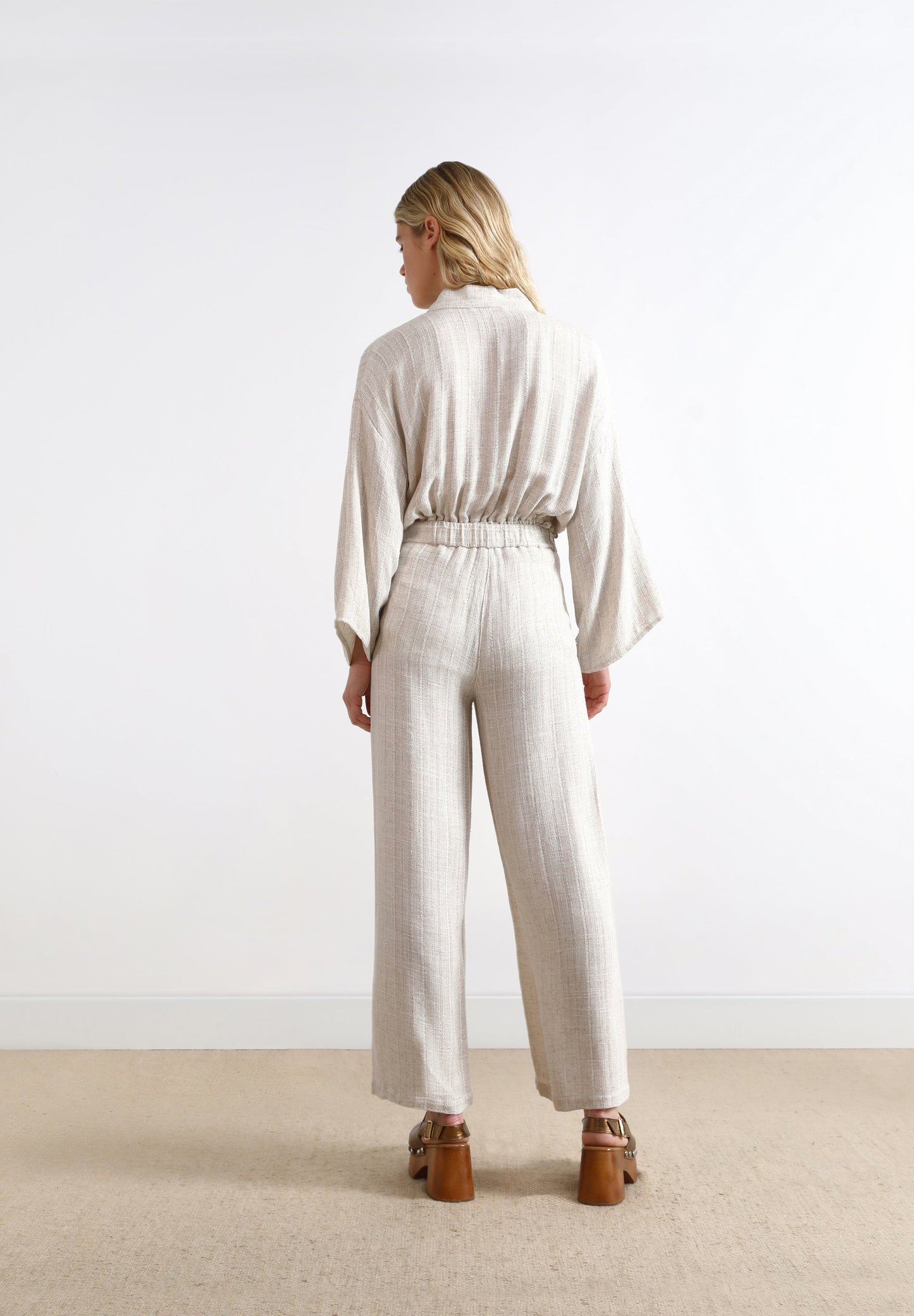 TROUSERS WITH METALLIC DETAILS