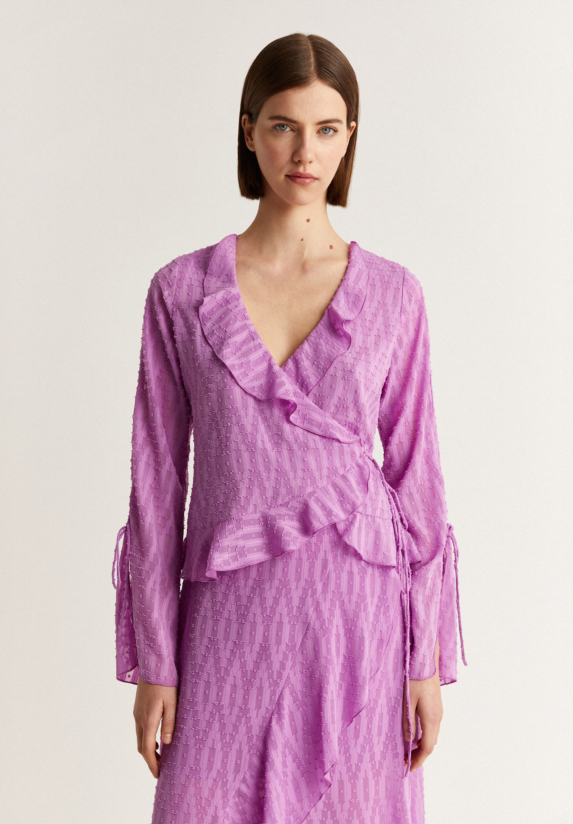 SWISS DOT BLOUSE WITH ASYMMETRIC HEM