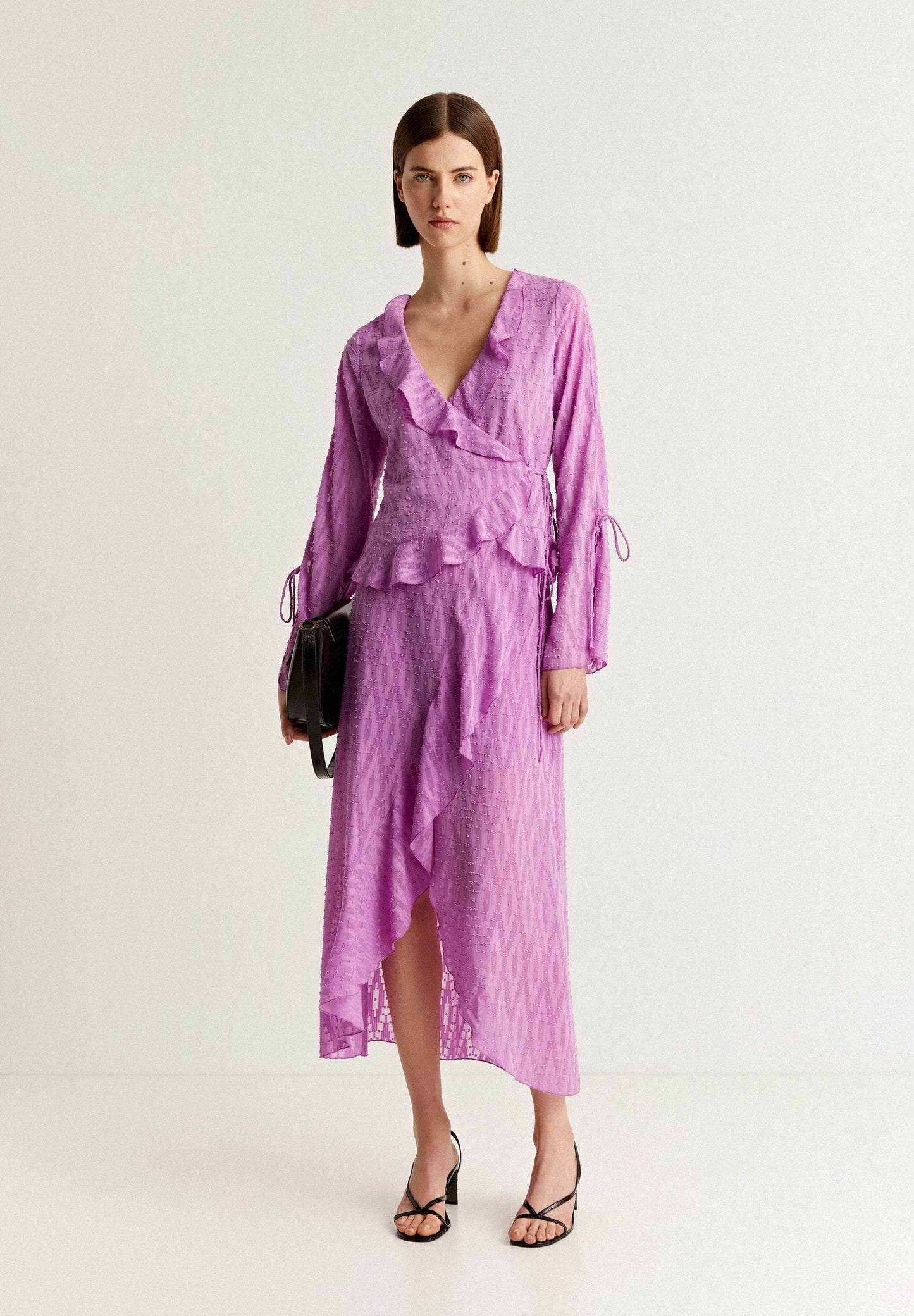 SWISS DOT BLOUSE WITH ASYMMETRIC HEM