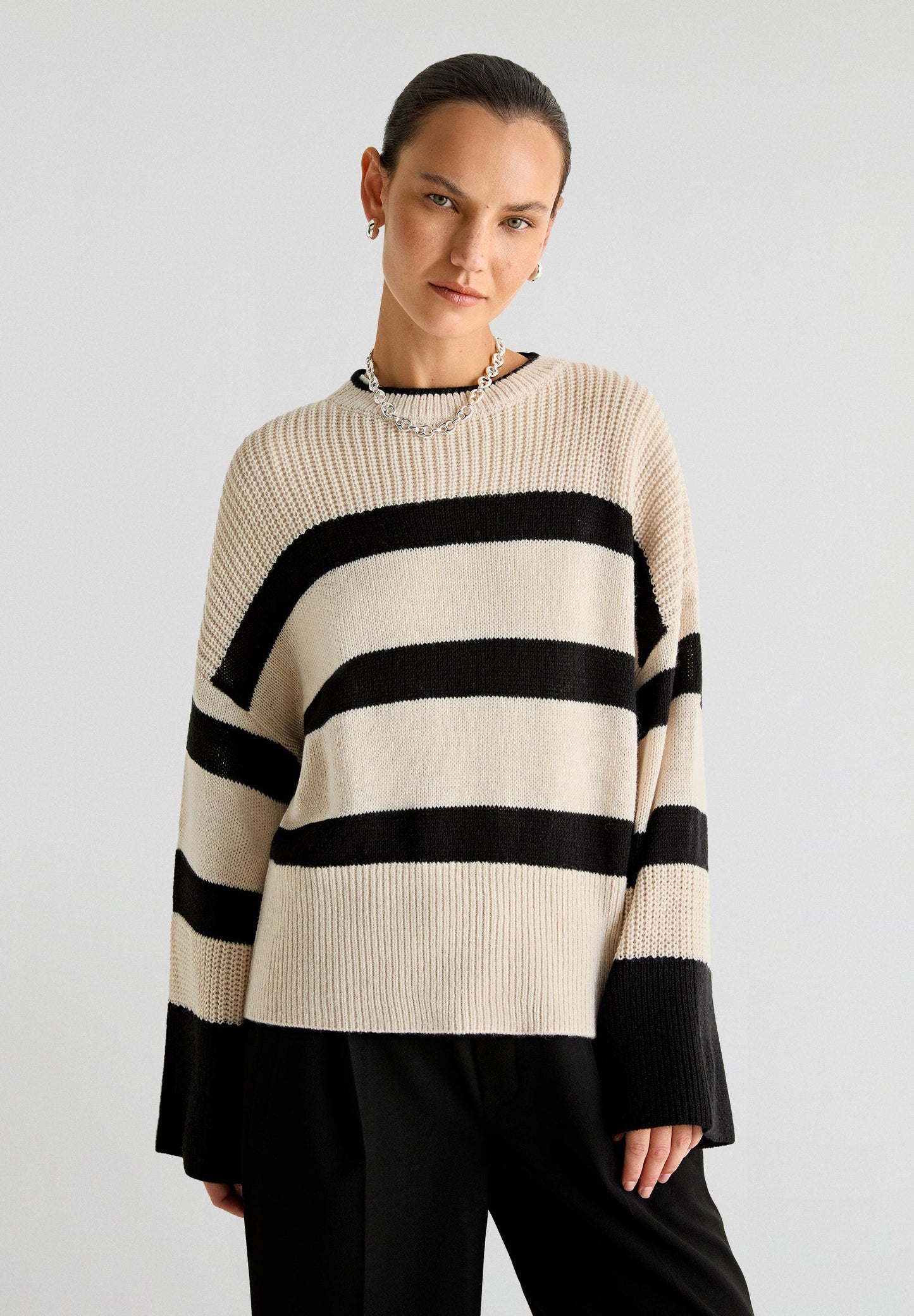 STRIPED SWEATER WITH FLARED SLEEVES