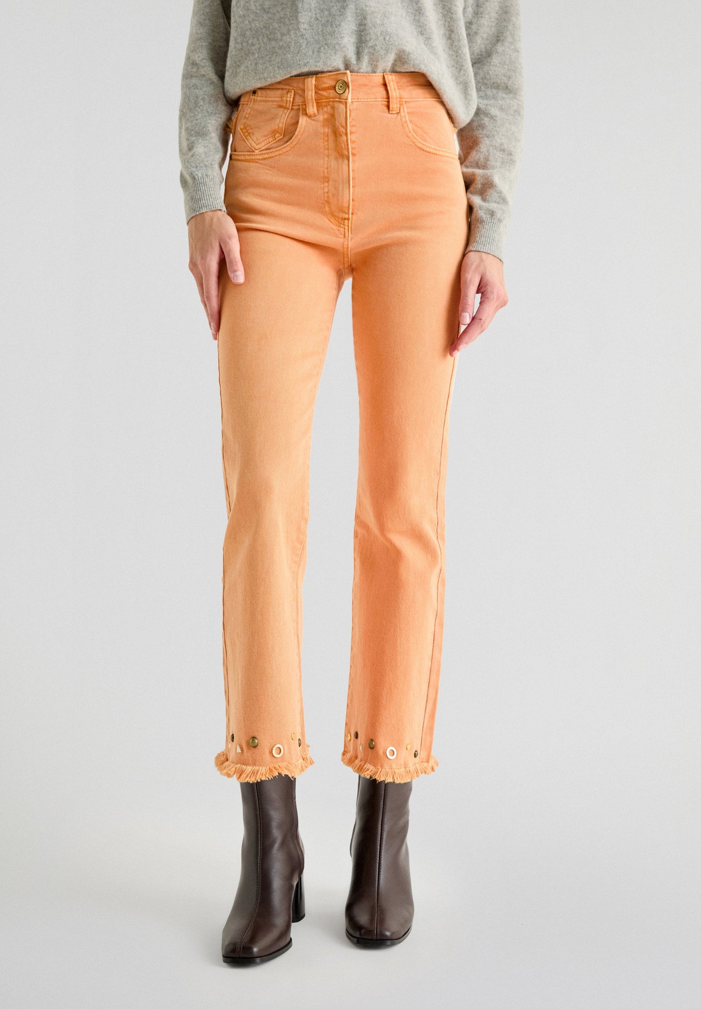 FLARED JEANS WITH STUDS ON THE HEMS