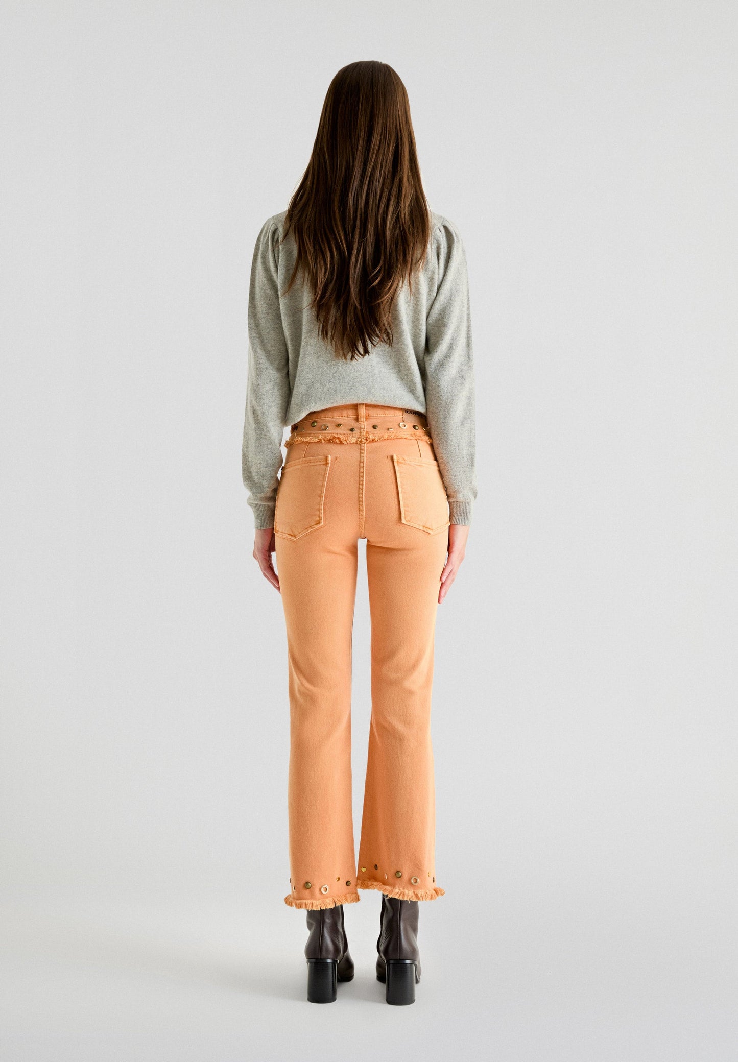 FLARED JEANS WITH STUDS ON THE HEMS