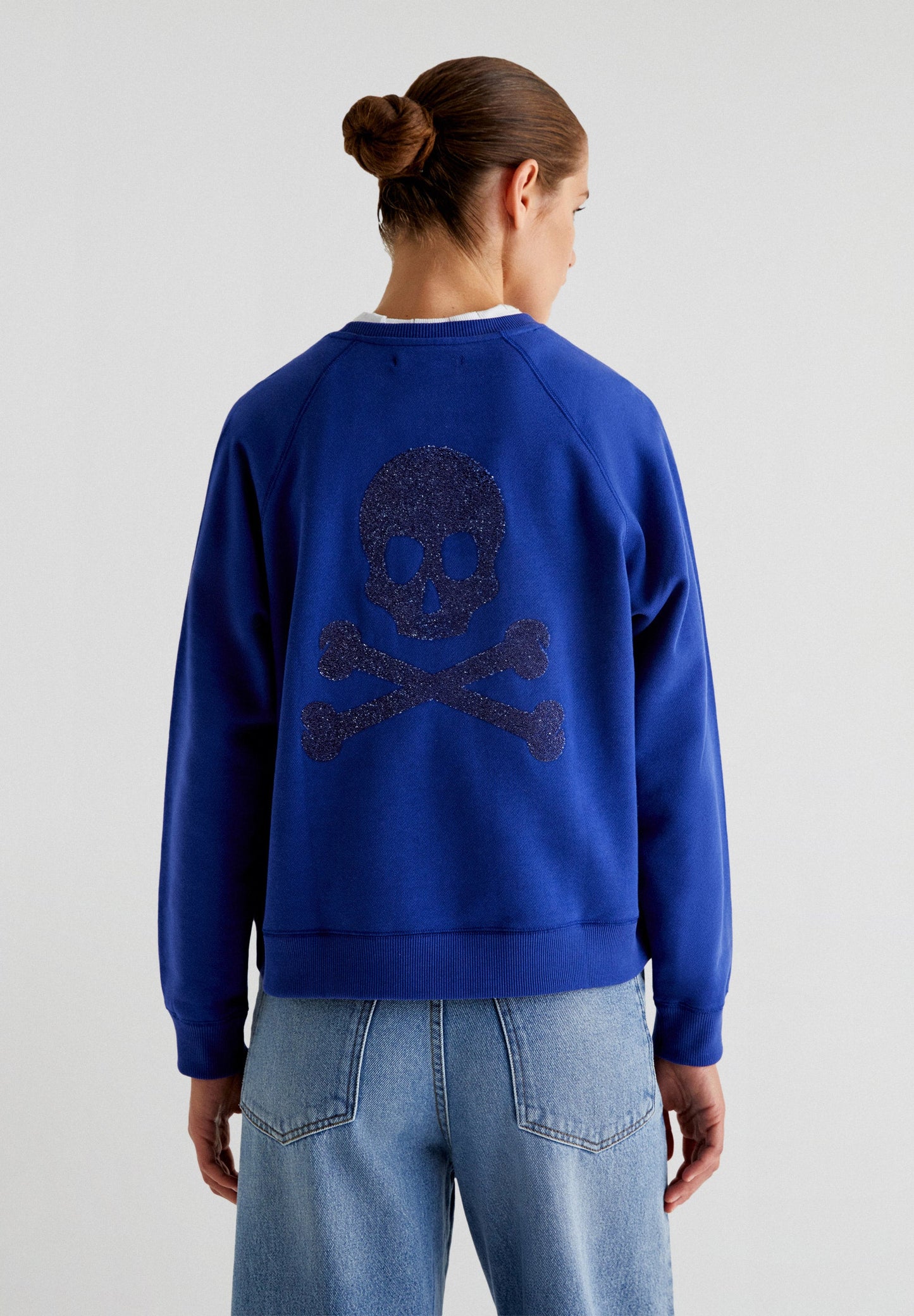 SWEATSHIRT WITH GLITTER SKULL ON THE BACK