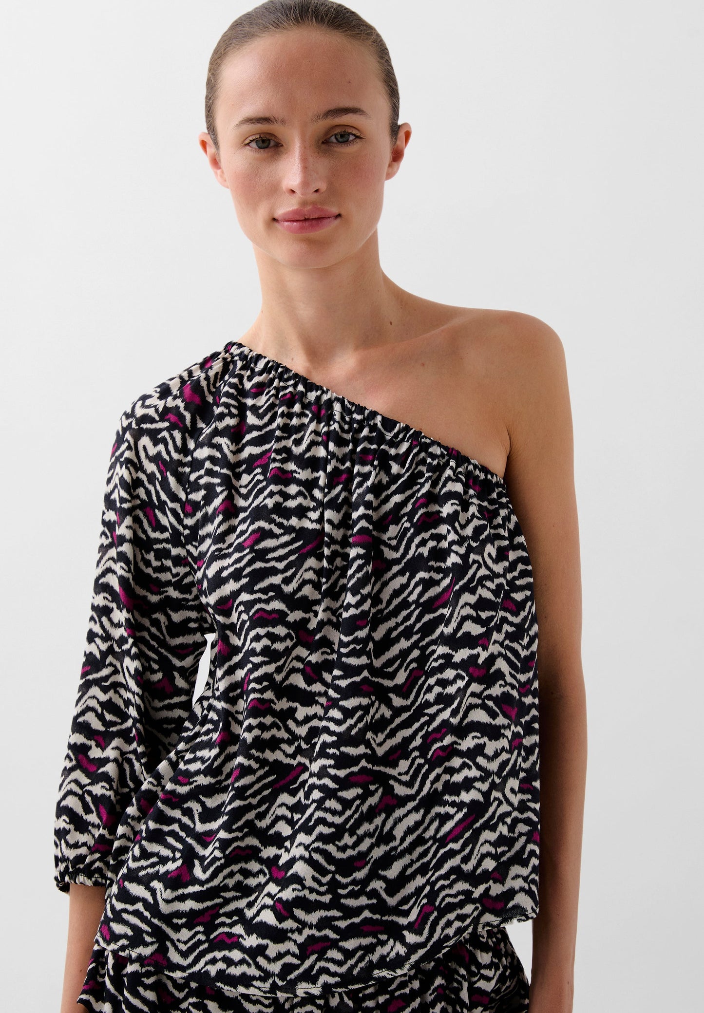 ASYMMETRIC ANIMAL PRINT BLOUSE