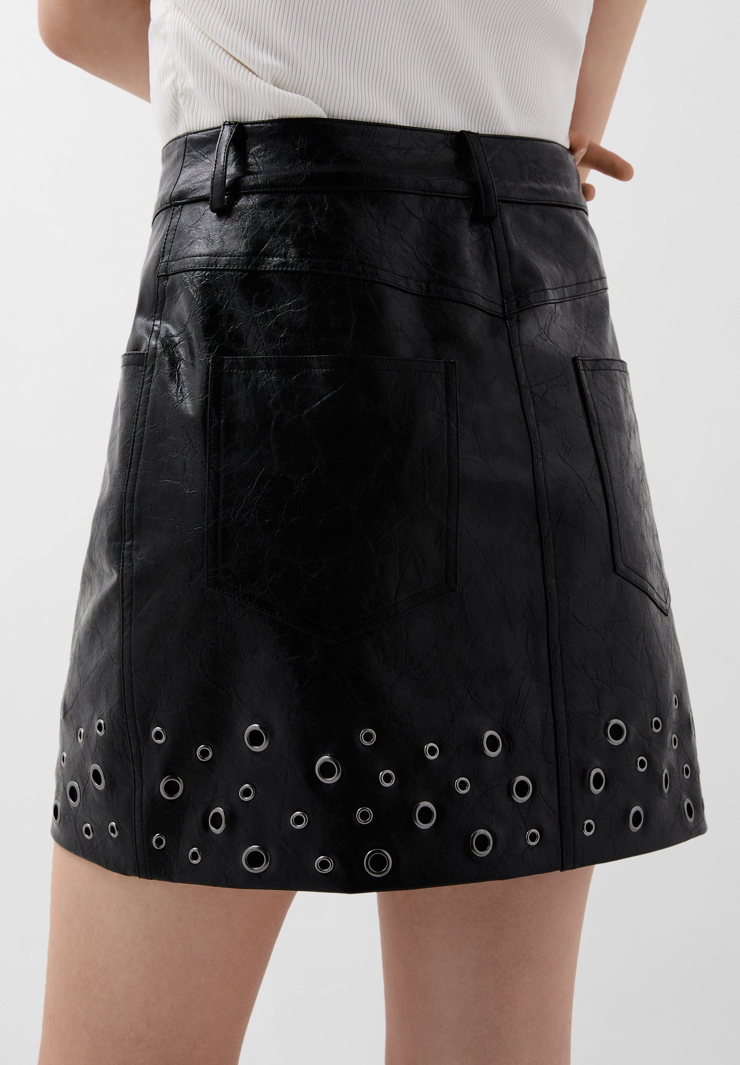 WAXED MINI SKIRT WITH EYELETS