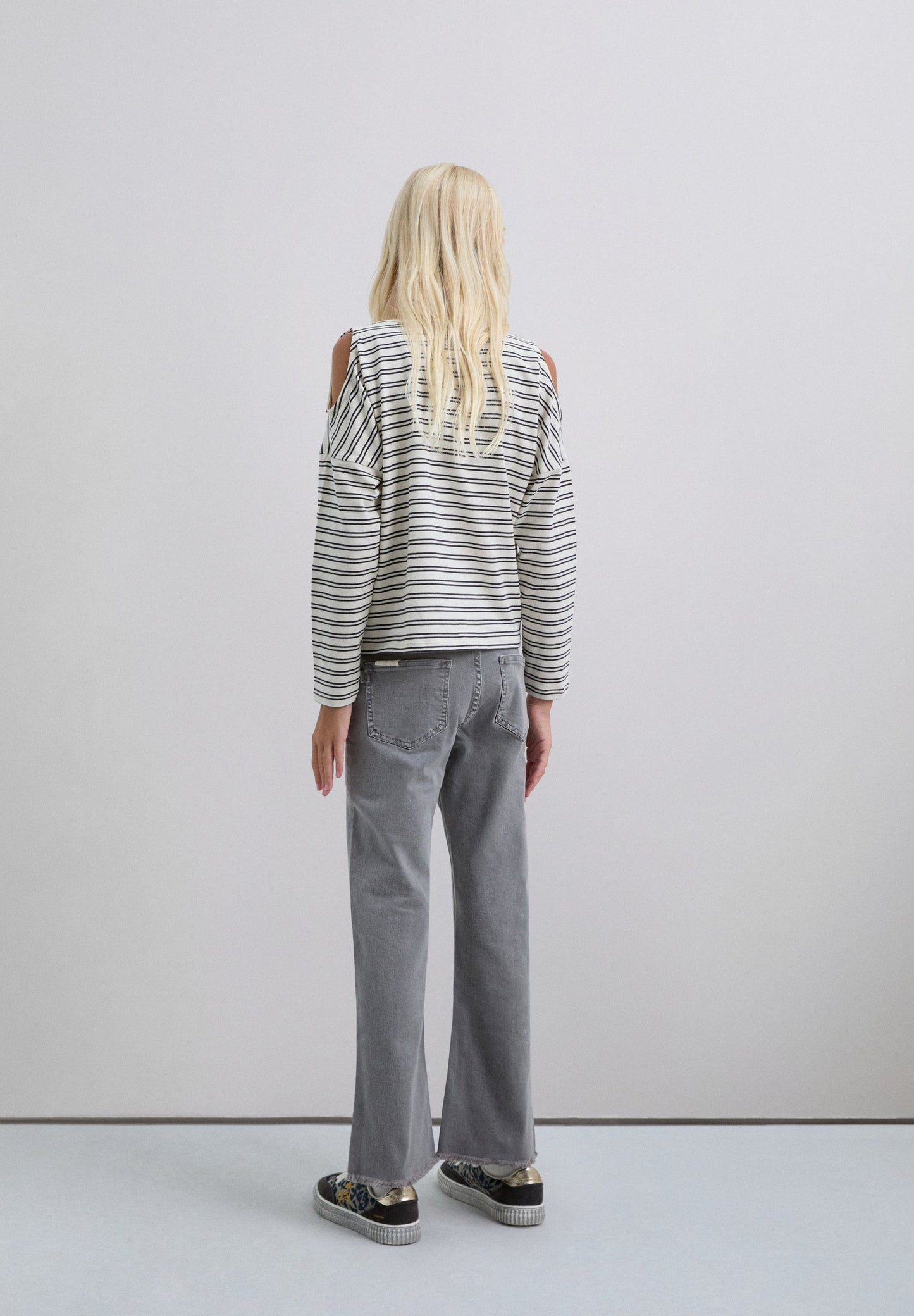 FLARED TROUSERS WITH FRINGING