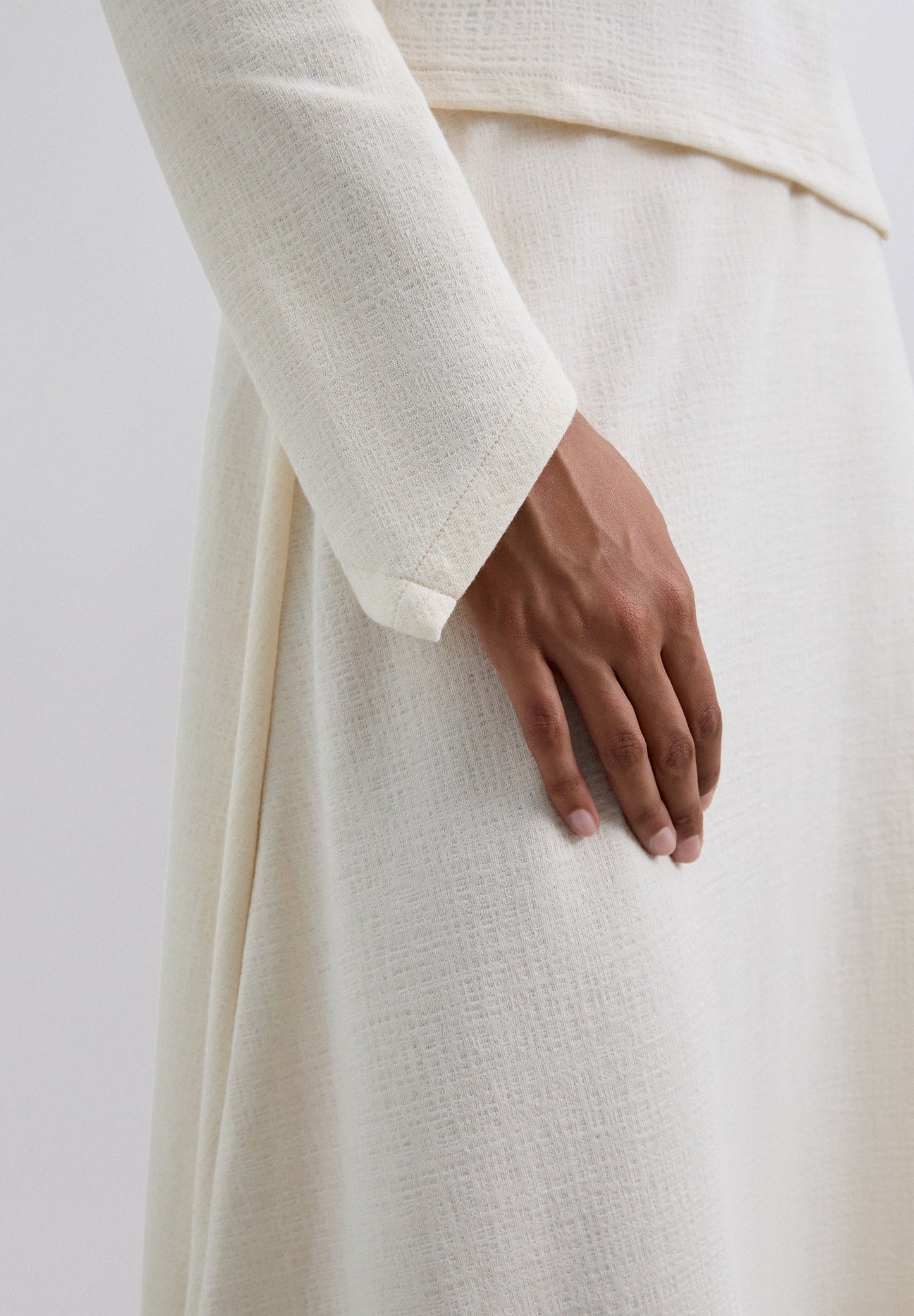 ASYMMETRIC KNIT MIDI SKIRT