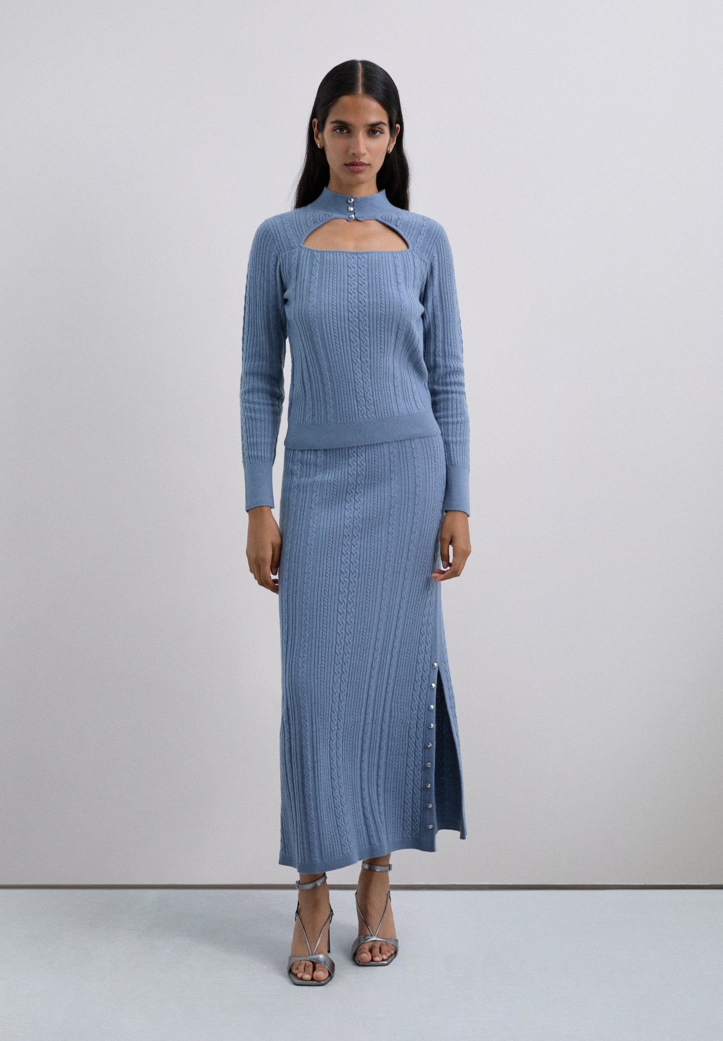 CABLE KNIT SWEATER WITH CUTOUT