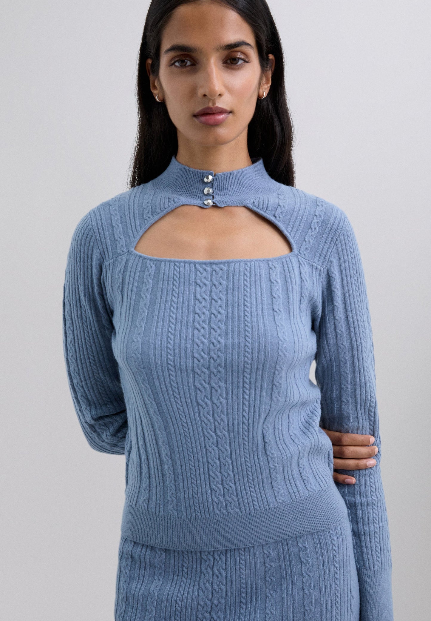 CABLE KNIT SWEATER WITH CUTOUT