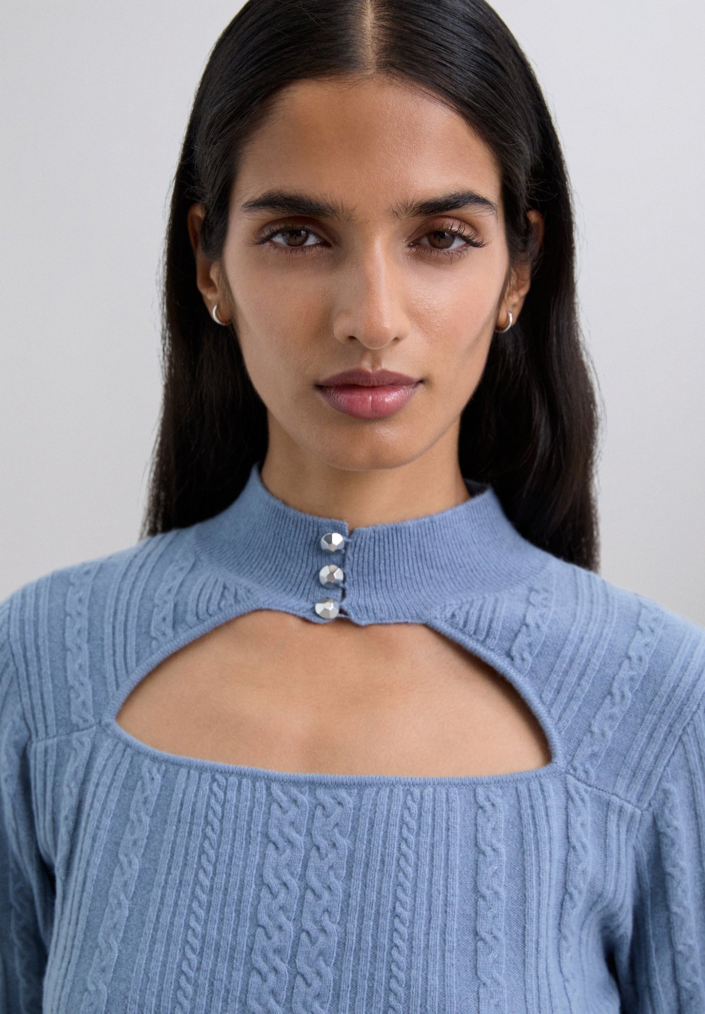 CABLE KNIT SWEATER WITH CUTOUT