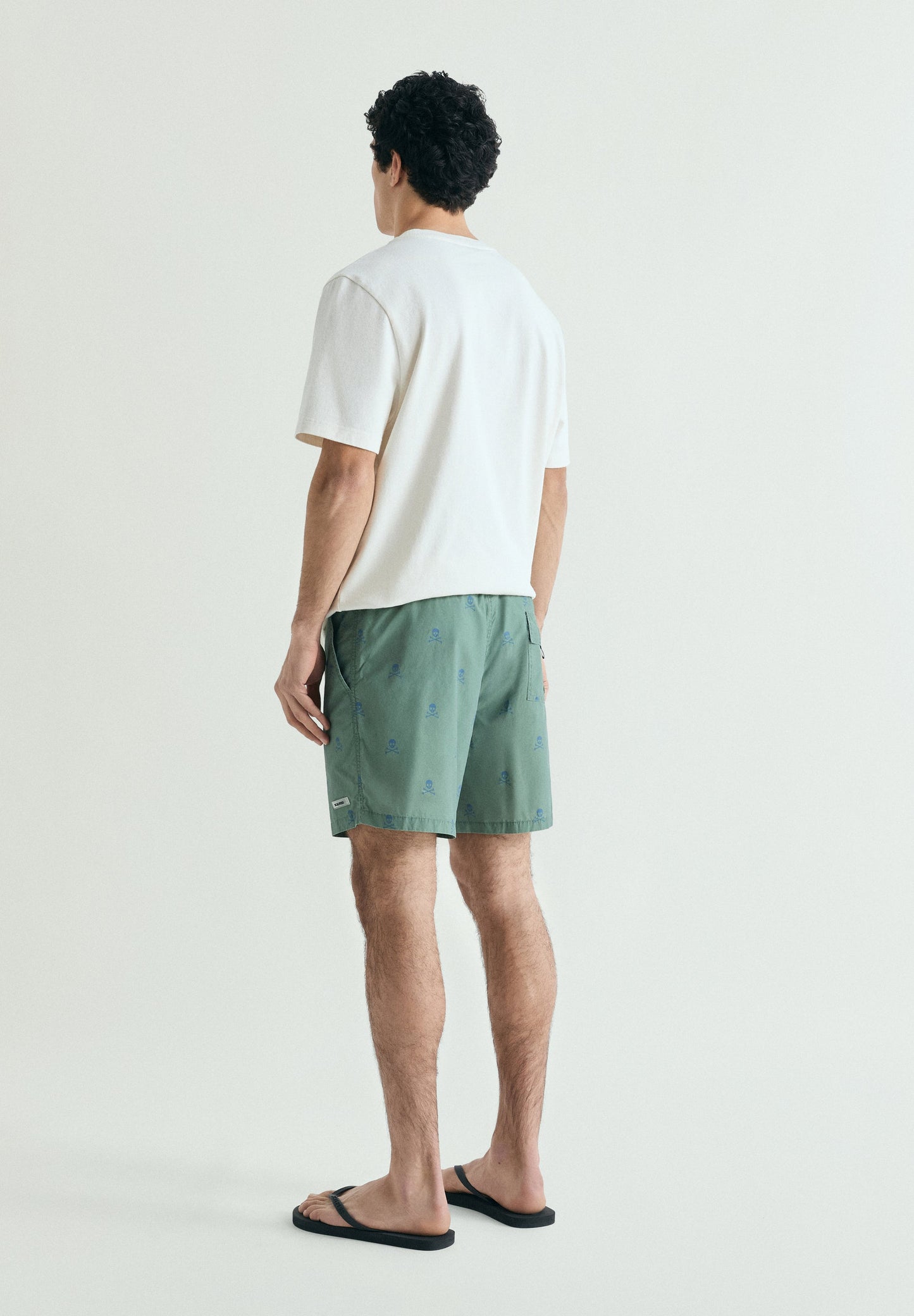 CONTRAST SKULL SWIMMING TRUNKS