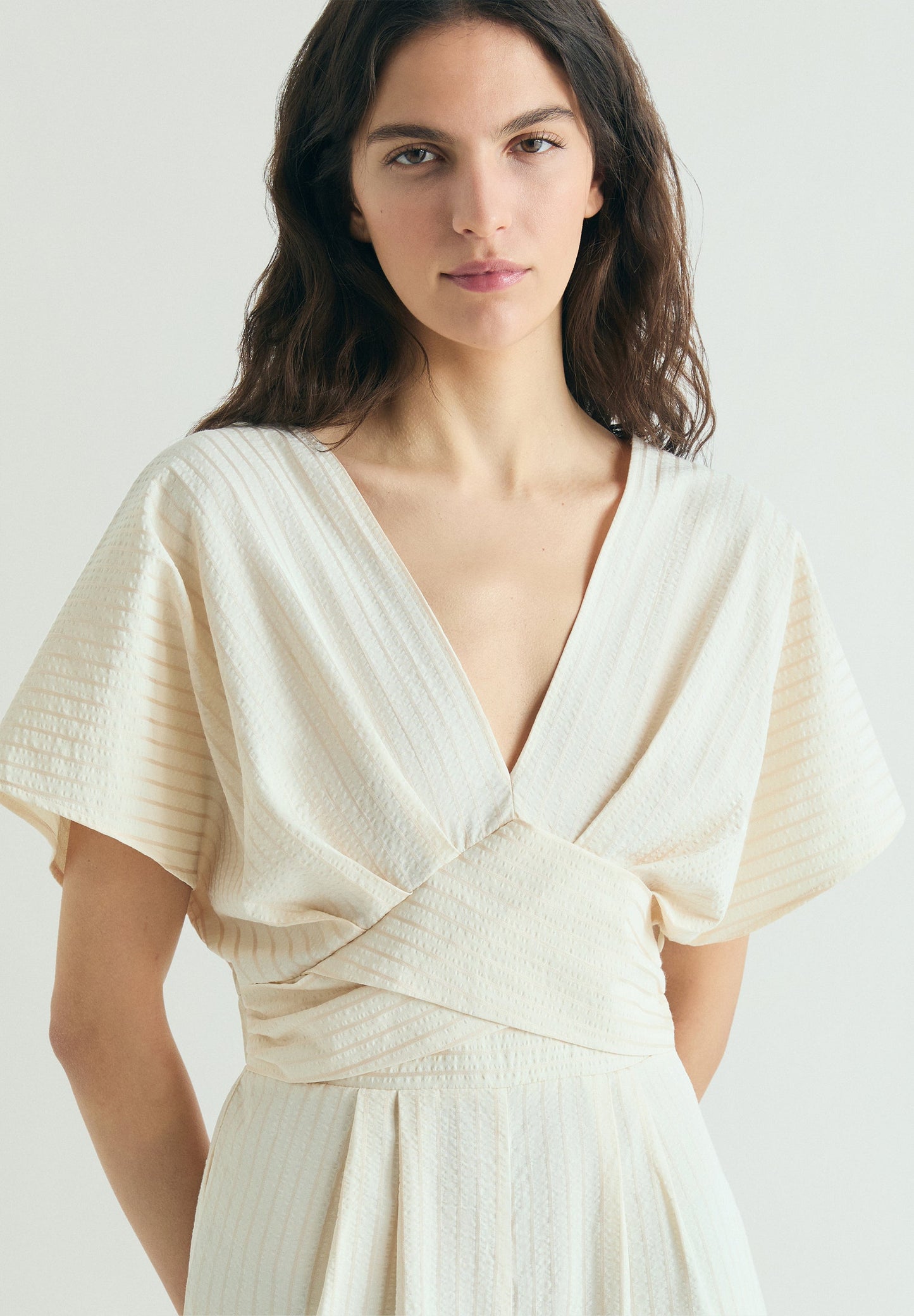 STRIPED JUMPSUIT WITH CROSSOVER WAIST