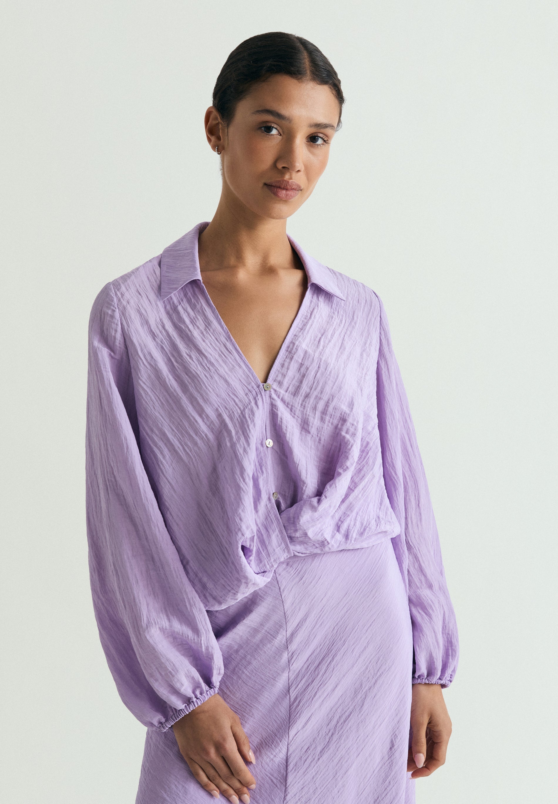 FLOWING BLOUSE WITH CRISS-CROS DETAIL