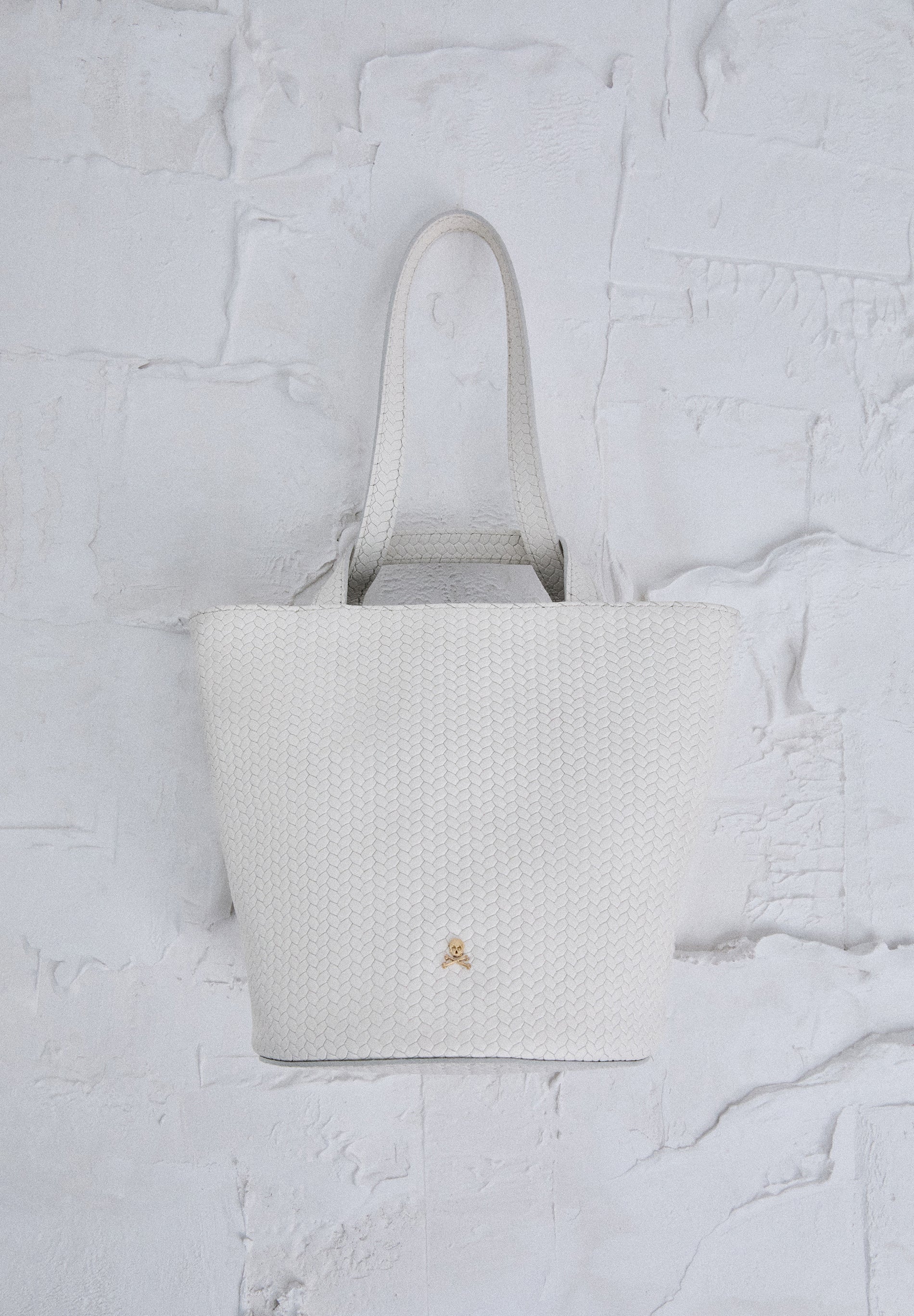 MINI BUCKET BAG IN 100% BRAIDED LEATHER