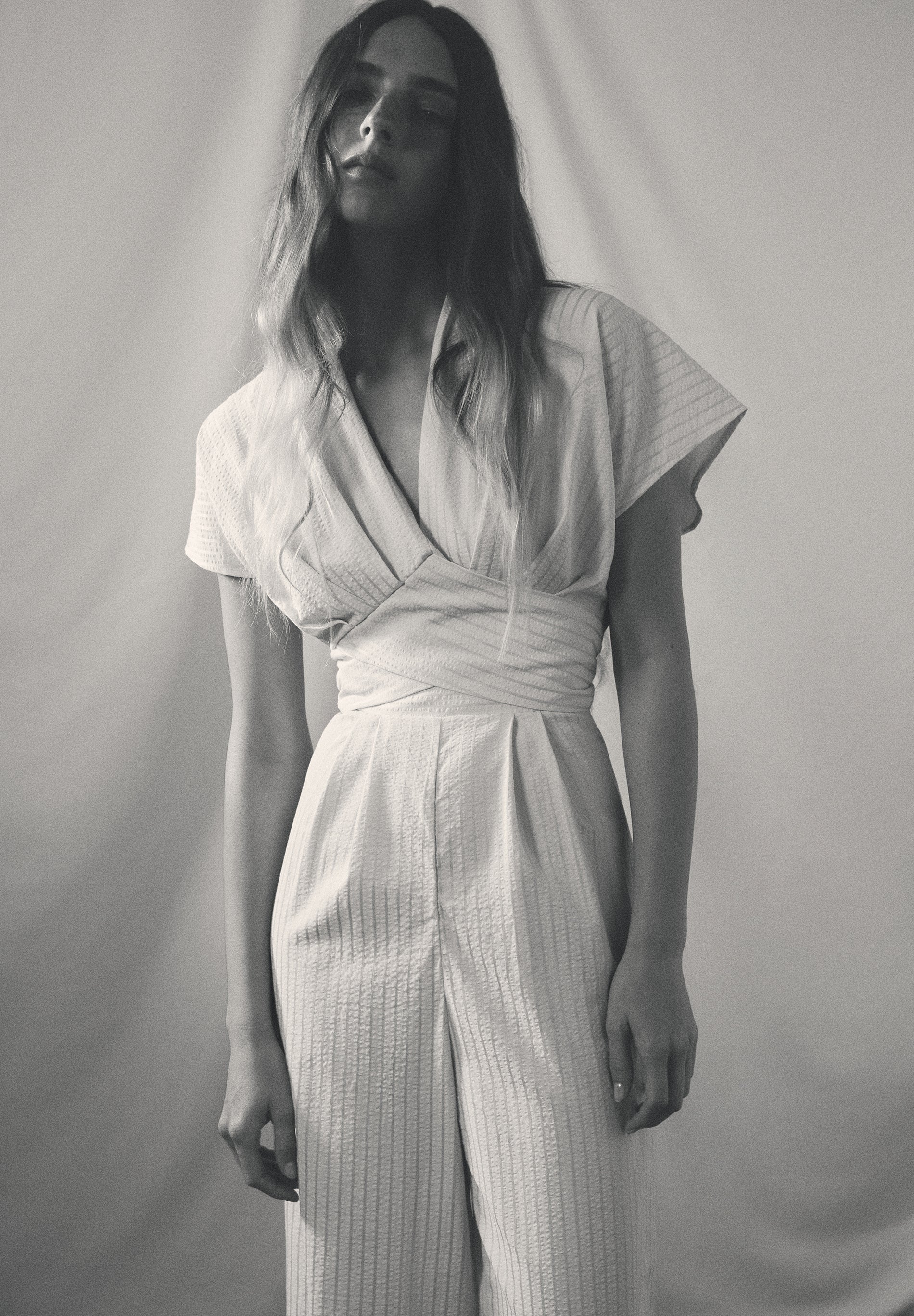 STRIPED JUMPSUIT WITH CROSSOVER WAIST